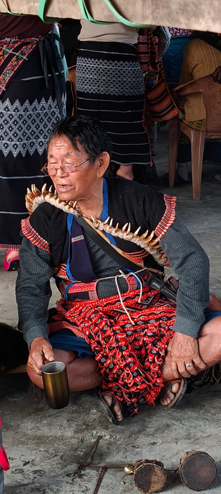 Idu Mishmi Igu (shaman-priest) in ceremonial dress with mithun-tooth necklace during Reh Festival rituals