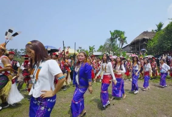 Wancho women in indigo and red wrap skirts with traditional jewellery dancing during the Oriah Festival, Longding District