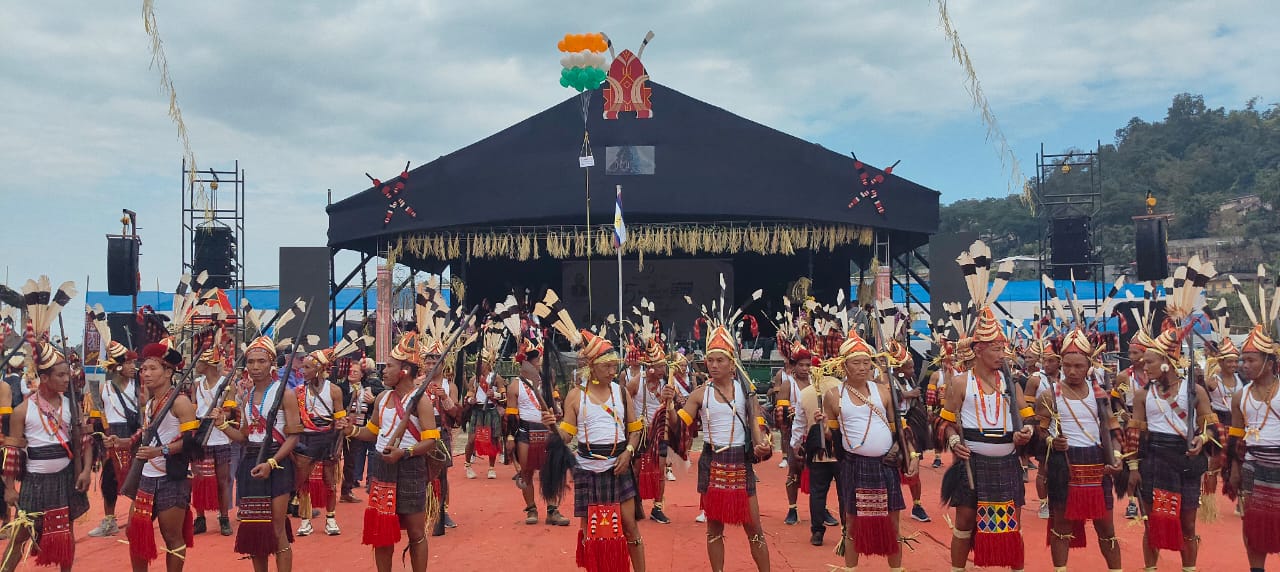 Mass formation of Nocte men with daos and headdresses at Chalo Loku, Khonsa
