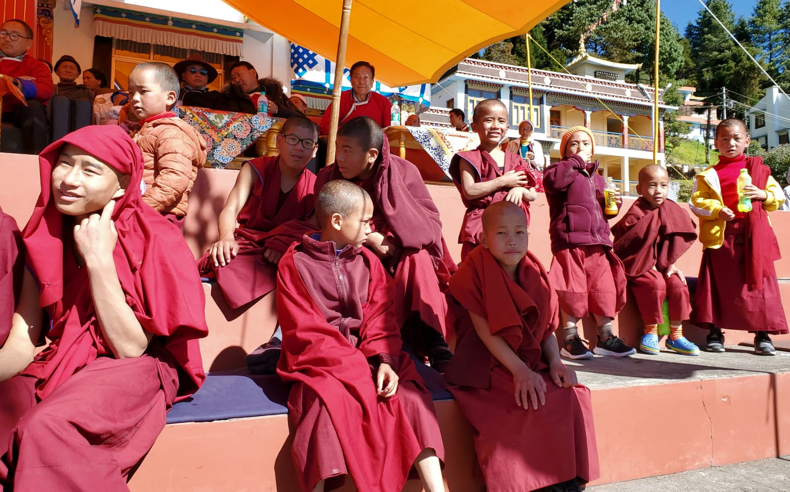 Young Monpa novice monks in maroon robes attending Losar Festival celebrations at Tawang Monastery