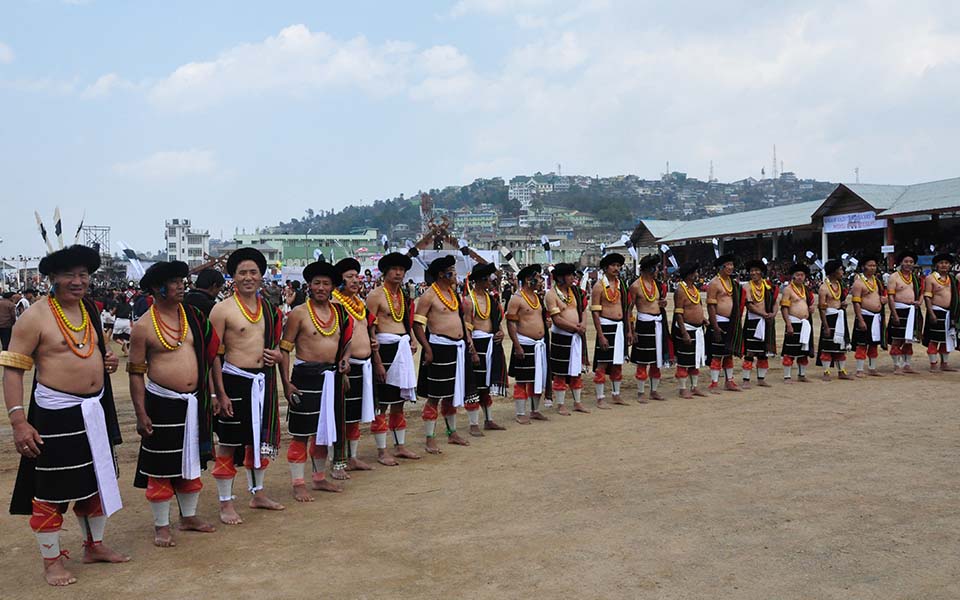 Angami Naga men in traditional dress lined up at the Sekrenyi Festival, Kohima, Nagaland